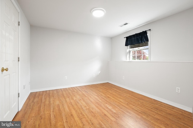 unfurnished room featuring light hardwood / wood-style floors