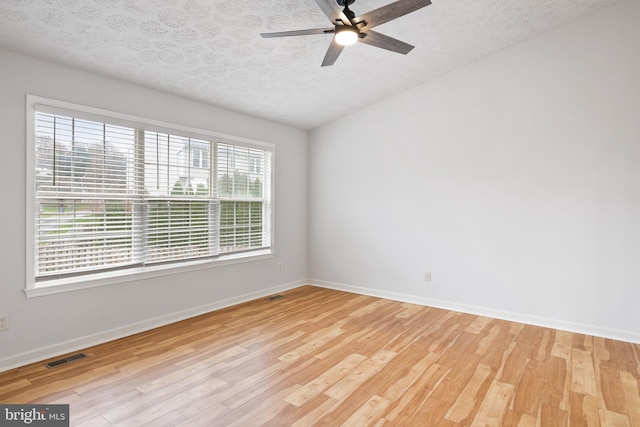 empty room with a healthy amount of sunlight and light wood-type flooring