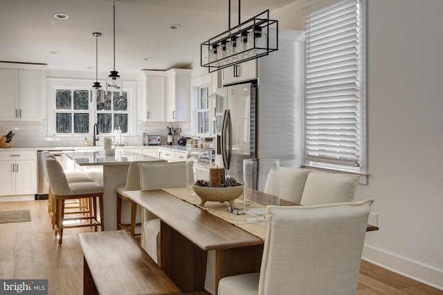 dining room featuring light hardwood / wood-style floors and sink