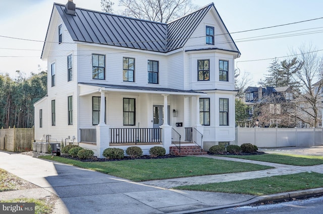 view of front facade with a porch and a front yard