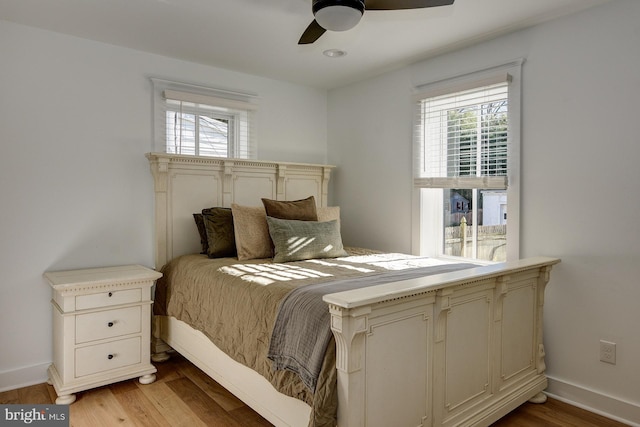 bedroom with light wood-type flooring and ceiling fan