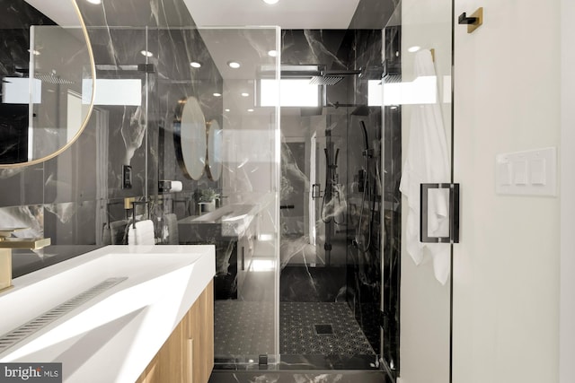 bathroom featuring vanity, tasteful backsplash, and walk in shower