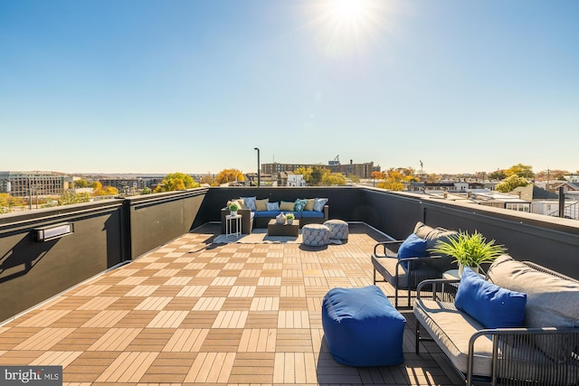 view of patio with outdoor lounge area and a balcony