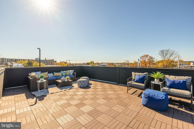 view of patio featuring a balcony and an outdoor hangout area