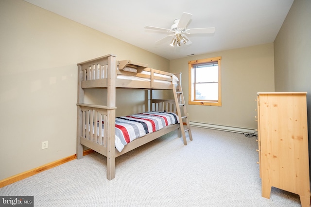 bedroom with ceiling fan, a baseboard heating unit, and carpet