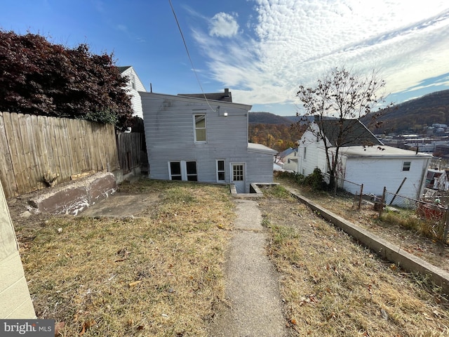 back of house featuring a mountain view