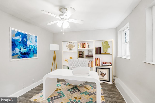 office space with dark wood-type flooring and ceiling fan