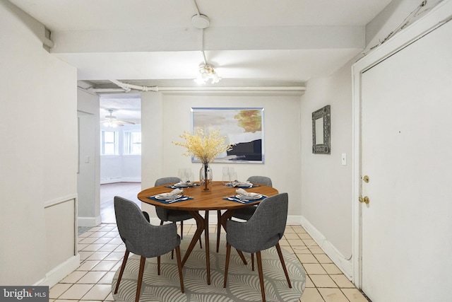 dining area with light tile patterned floors and ceiling fan