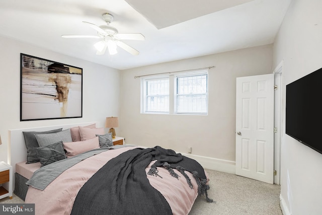 bedroom featuring light carpet and ceiling fan