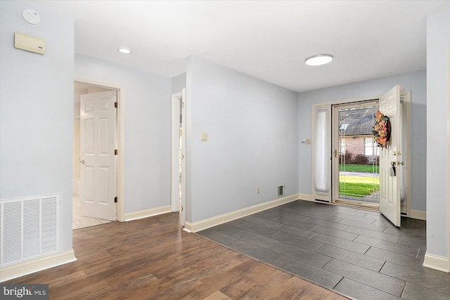 entryway with dark wood-type flooring