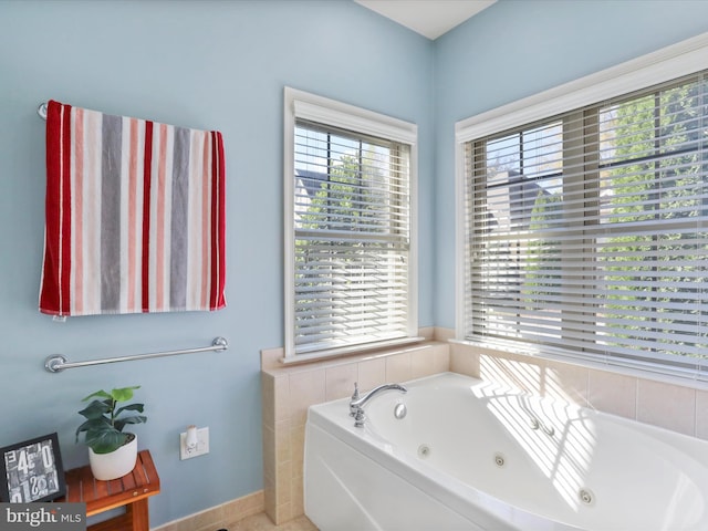 bathroom with a tub to relax in