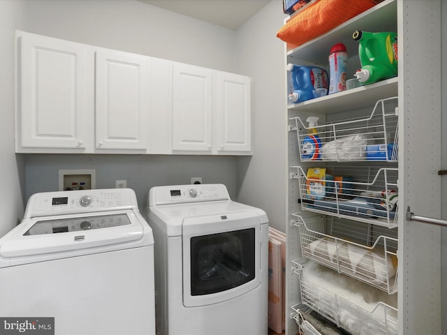 laundry area featuring cabinets and washer and dryer