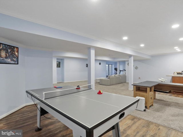 playroom with hardwood / wood-style floors and ornamental molding