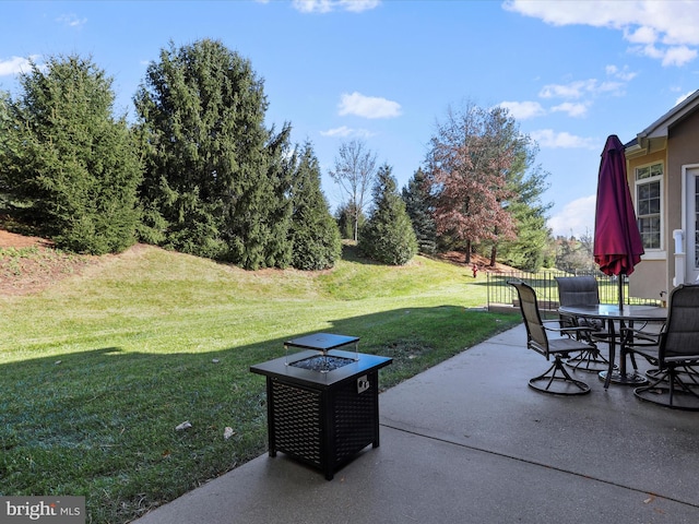 view of patio featuring an outdoor fire pit