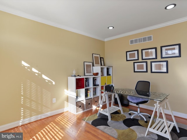 office area featuring hardwood / wood-style flooring and ornamental molding