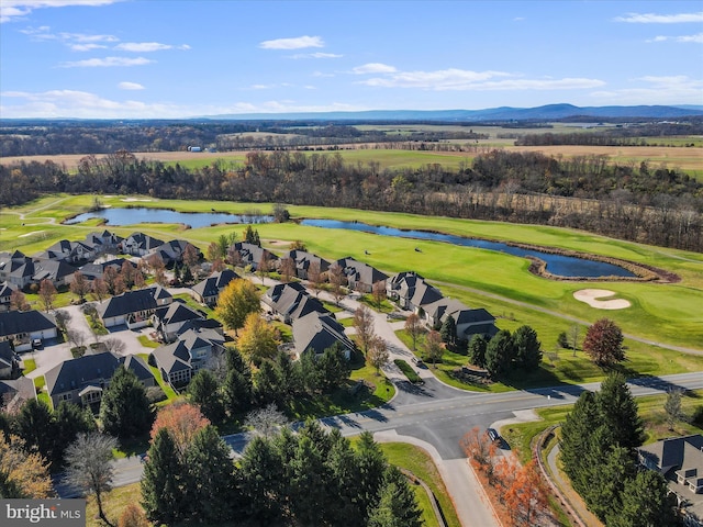 drone / aerial view featuring a water and mountain view