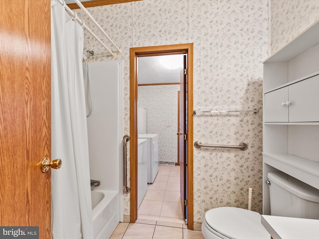 bathroom featuring toilet, tile patterned flooring, shower / bathtub combination with curtain, and independent washer and dryer