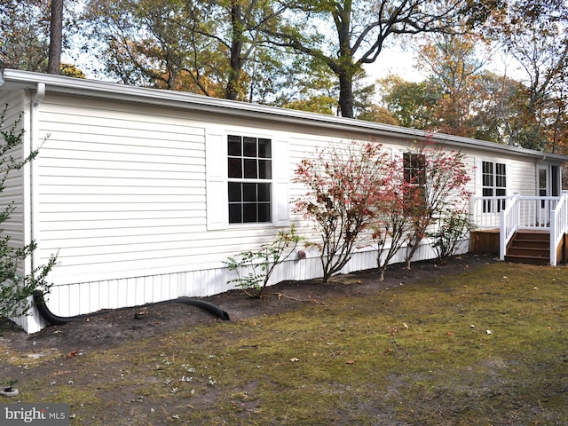 view of home's exterior featuring a yard