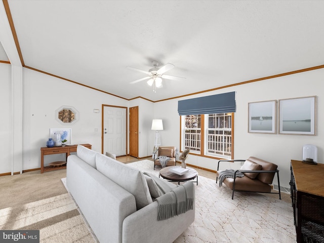 carpeted living room featuring ceiling fan and crown molding