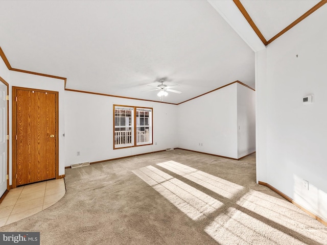 unfurnished living room with light colored carpet, vaulted ceiling, ceiling fan, and ornamental molding