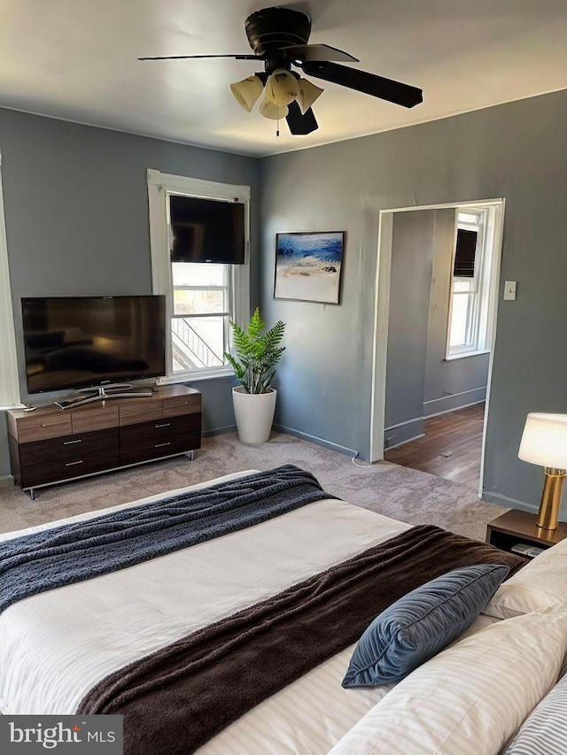 bedroom featuring ceiling fan and carpet floors