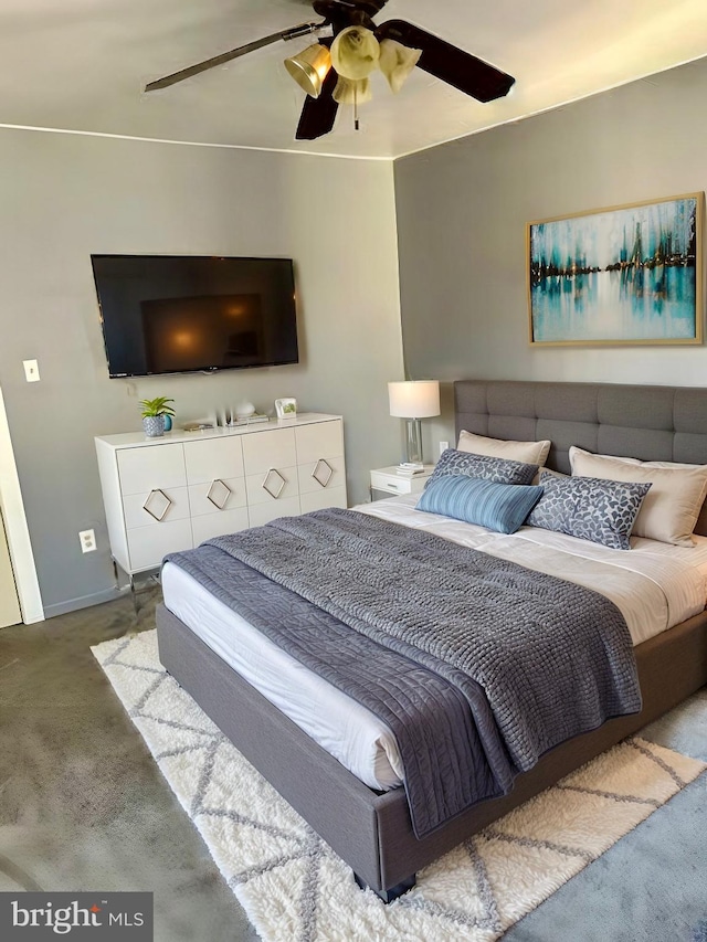 carpeted bedroom with ceiling fan