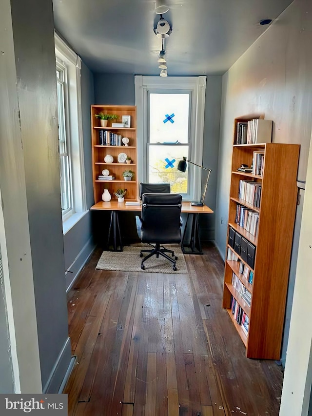 office with dark hardwood / wood-style flooring and a wealth of natural light