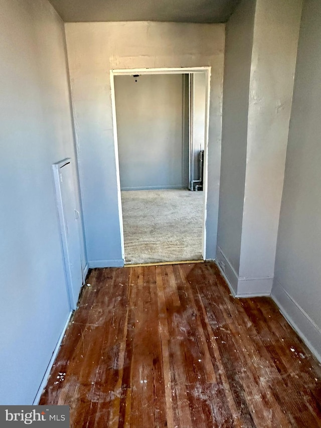 corridor featuring dark hardwood / wood-style floors