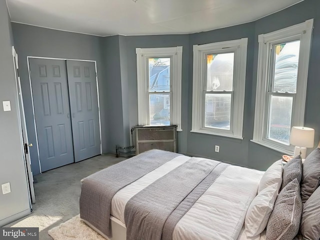 carpeted bedroom featuring a closet