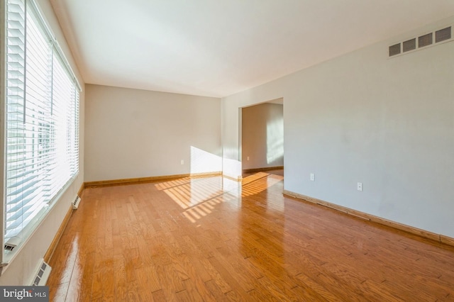 unfurnished room featuring light wood-type flooring