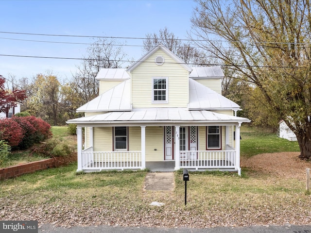 view of front of home with a front lawn and covered porch