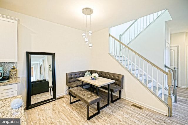 dining room with light hardwood / wood-style floors