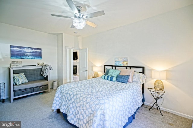 bedroom featuring ceiling fan and carpet floors