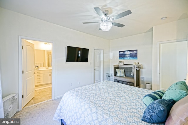 carpeted bedroom featuring ensuite bathroom and ceiling fan