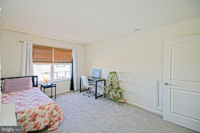 bedroom featuring light carpet