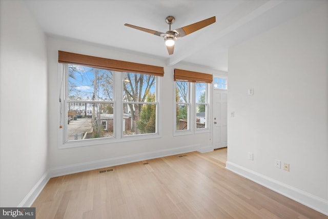 unfurnished dining area featuring ceiling fan and light wood-type flooring