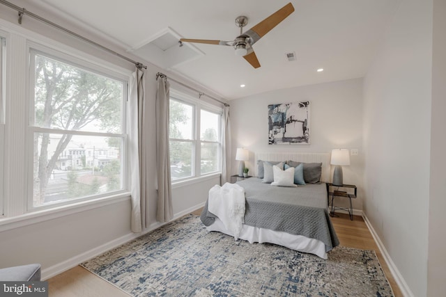 bedroom featuring ceiling fan and light hardwood / wood-style flooring