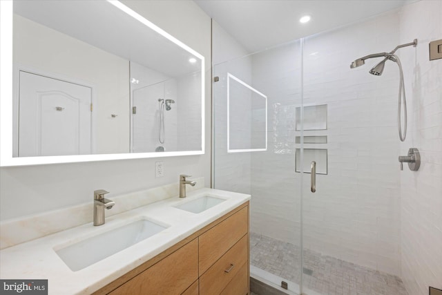 bathroom featuring vanity and an enclosed shower