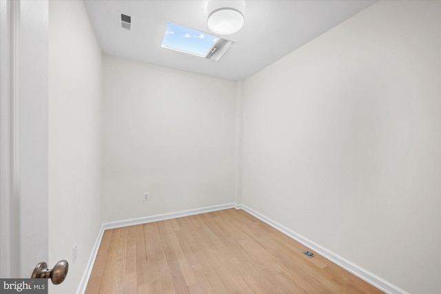 empty room with hardwood / wood-style flooring