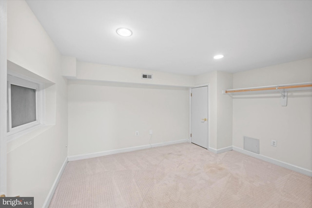 basement with light carpet