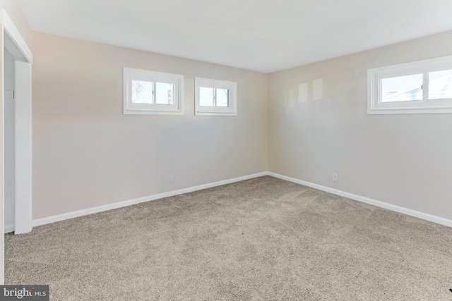 basement with carpet floors and a healthy amount of sunlight