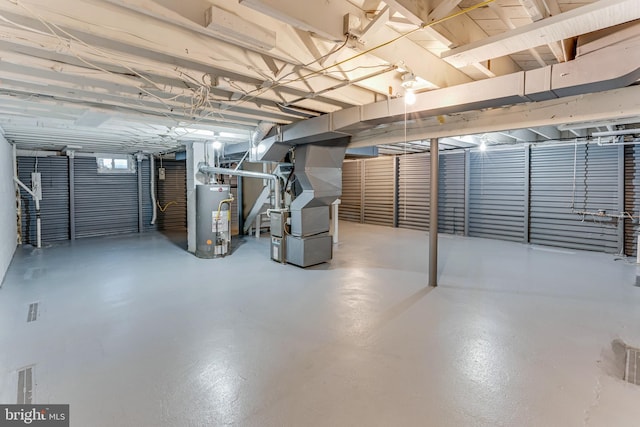 basement with heating unit and water heater