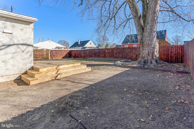 view of yard with a wooden deck