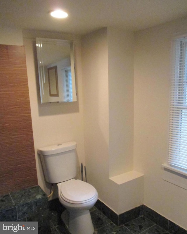 bathroom with tile patterned flooring and toilet