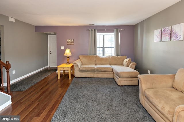 living room featuring dark wood-type flooring