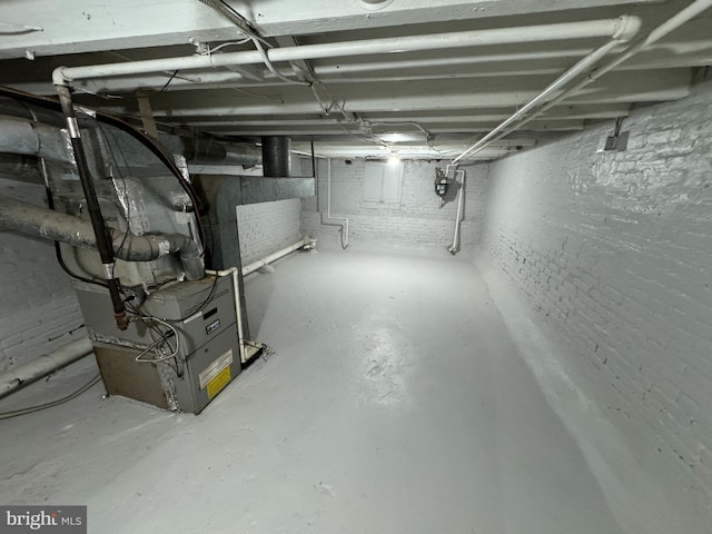 basement featuring heating unit