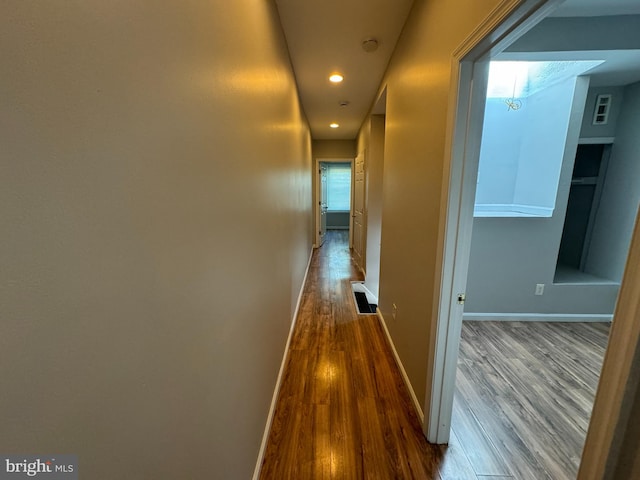 corridor featuring hardwood / wood-style floors