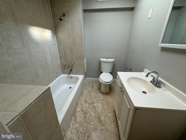 full bathroom featuring toilet, vanity, and tiled shower / bath