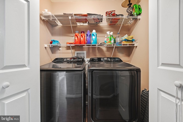 laundry area featuring washing machine and clothes dryer