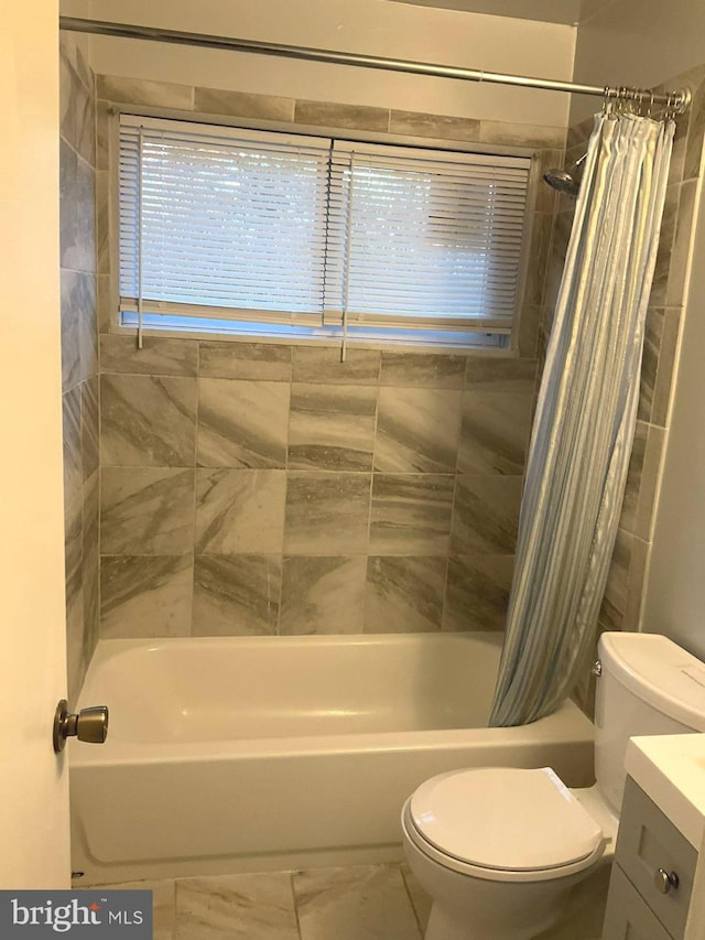 full bathroom featuring vanity, shower / bathtub combination with curtain, and toilet